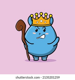 Cute cartoon goblin monster mascot as wise king with golden crown and wooden stick