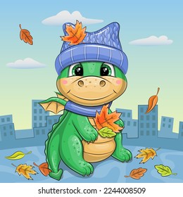 Cute cartoon green dragon in a hat and scarf with autumn leaves. Autumn vector illustration with an animal on a blue background.