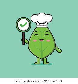 Caricatura corta de un personaje de un chef de hoja verde sosteniendo una señal correcta en la ilustración de un personaje de fruta vectorial