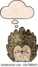 cute cartoon hedgehog with thought bubble in grunge texture style