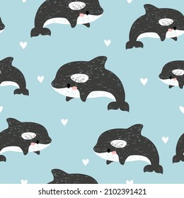 Cute cartoon killer whales seamless pattern. Baby print.