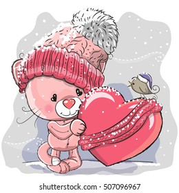 Cute Cartoon kitten in a knitted cap and a heart wrapped in a scarf