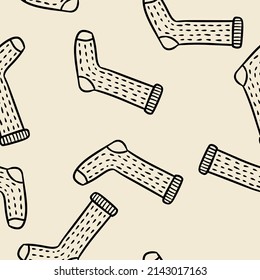 Cute cartoon knitted socks doodles seamless border pattern. Vector repeatable background texture tile. Cozy template of stock image for wrapping design, wallpaper