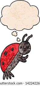 cute cartoon ladybug with thought bubble in grunge texture style