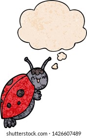 cute cartoon ladybug with thought bubble in grunge texture style