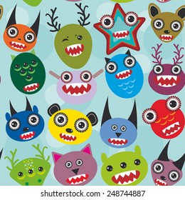 Cute cartoon muzzle Monsters seamless pattern on blue background. Vector