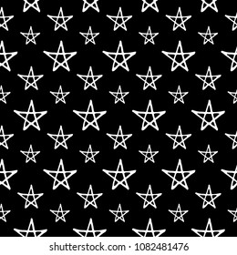 Cute cartoon night sky background with hand drawn stars. Sweet vector black and white night sky background. Seamless monochrome doodle night sky background for fabric, wallpapers and wrapping paper.