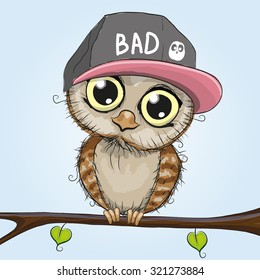 Cute cartoon owl in a cap is sitting on a branch