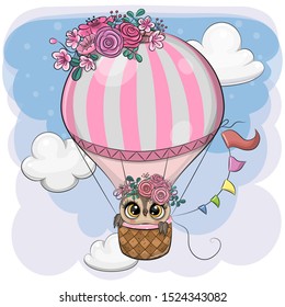 Cute Cartoon Owl is flying on a hot air balloon
