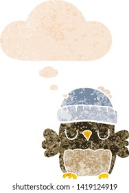 cute cartoon owl in hat with thought bubble in grunge distressed retro textured style