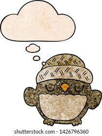 cute cartoon owl in hat with thought bubble in grunge texture style