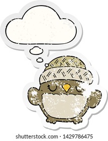 cute cartoon owl in hat with thought bubble as a distressed worn sticker