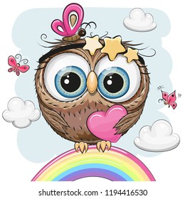 Cute Cartoon Owl with heart is sitting on a rainbow