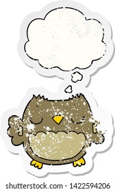 cute cartoon owl with thought bubble as a distressed worn sticker