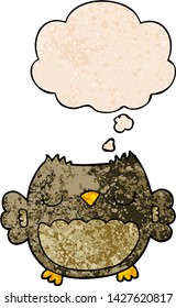 cute cartoon owl with thought bubble in grunge texture style