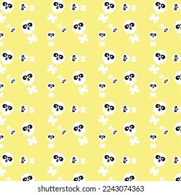 Cute cartoon pattern on yellow background with skulls and bones in white