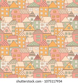 Cute cartoon pattern with tiny houses and trees. Hand drawn seamless ornament with hand drawn town.