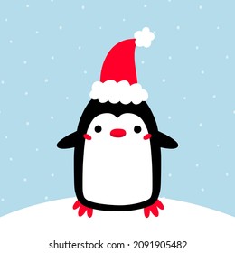 Cute cartoon penguin with red hat.
