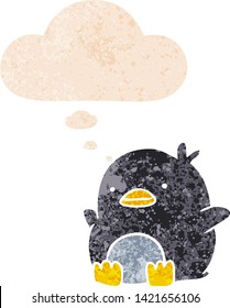 cute cartoon penguin with thought bubble in grunge distressed retro textured style