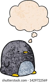 cute cartoon penguin with thought bubble in grunge texture style