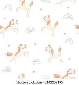 Cute cartoon ponies. Vector seamless pattern with white horses, rainbow and hearts. Isolated on white background. Can be used for nursery, decoration, fabric, scrapbooking and much more.