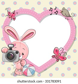 Cute cartoon Rabbit with a camera and a heart frame
