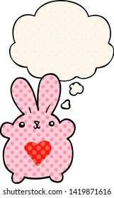 cute cartoon rabbit with love heart with thought bubble in comic book style