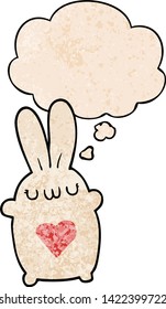 cute cartoon rabbit with love heart with thought bubble in grunge texture style