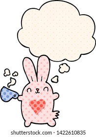 cute cartoon rabbit with love heart and coffee cup with thought bubble in comic book style