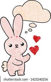 cute cartoon rabbit with love hearts with thought bubble in grunge texture style