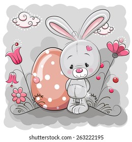 Cute Cartoon Rabbit on a meadow with egg
