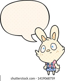 cute cartoon rabbit shrugging shoulders with speech bubble in comic book style