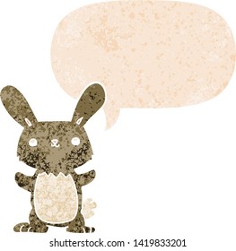 cute cartoon rabbit with speech bubble in grunge distressed retro textured style