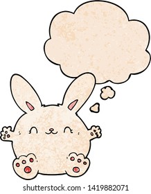cute cartoon rabbit with thought bubble in grunge texture style