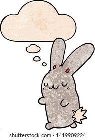 cute cartoon rabbit with thought bubble in grunge texture style