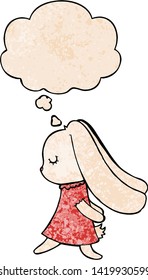 cute cartoon rabbit with thought bubble in grunge texture style