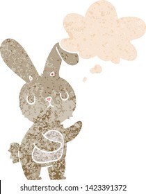 cute cartoon rabbit with thought bubble in grunge distressed retro textured style