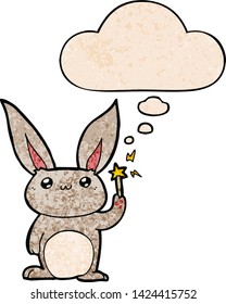 cute cartoon rabbit with thought bubble in grunge texture style
