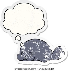 cute cartoon seal with thought bubble as a distressed worn sticker