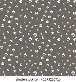 Cute cartoon seamless pattern design. Cat paw print. Animal tracks. Seamless flat background.