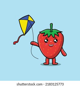 Cute cartoon strawberry character playing kite flaying cartoon icon vector illustration