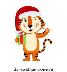 Cute cartoon striped red tiger. Tiger in a Santa Claus hat waves and holds a gift. Printing for children's T-shirts, greeting cards, posters. Hand-drawn vector stock illustration isolated on a white