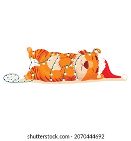 Cute cartoon striped red tiger. A tiger in a Christmas hat lies wrapped in a garland. Printing of children's t-shirts, cards, posters. Hand drawn vector stock illustration isolated on white.