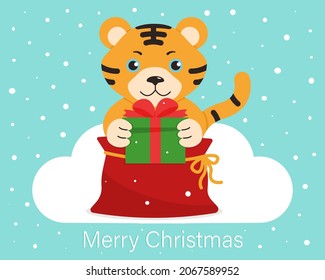 Tigre lindo, de dibujos animados con una caja de regalo sobre un fondo azul. Diseño postal. Feliz Navidad. Ilustración vectorial en estilo plano