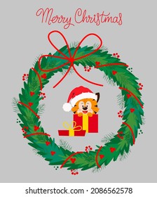 Cute cartoon Tiger in a Santa Claus hat with a Christmas wreath, in a gift box. Christmas card.