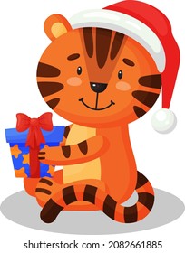 Cute cartoon tiger in Santa hat sits holding a gift. New Year vector illustration isolated on white.
