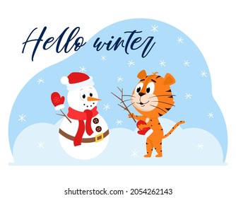 Cute cartoon tiger sculpts a snowman. A snowman with a scarf and a carrot. A postcard with an adorable character and the words Hello winter. Color vector illustration on a blue spot background.