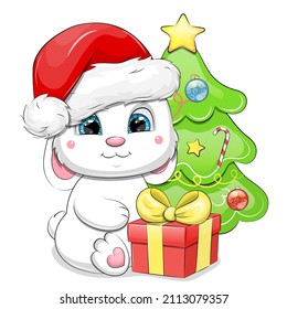 Cute Cartoon White Rabbit In A Santa Hat Sits Next To A Gift And A Christmas Tree. Winter Vector Illustration With Animal Isolated On White Background.