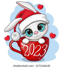 Cute Cartoon White Rabbit in a Santa hat is sitting in a Cup