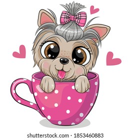 Cute Cartoon Yorkshire terrier with a bow is sitting in a Cup of coffee